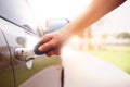 Woman`s hand opening a car`s door with key Royalty Free Stock Photo