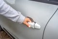 Woman`s hand opens white car door. Woman opens car door. Business woman opening car door, holding handle. Close up of hand female Royalty Free Stock Photo