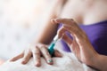 Woman`s hand is painted on the nail. Royalty Free Stock Photo
