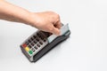 Woman`s hand passing credit card by a dataphone, card reader to charge in time of sales Royalty Free Stock Photo