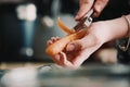 Woman& x27;s hand peeling a carrot Royalty Free Stock Photo