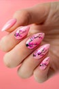 A woman& x27;s hand with pink nail polish and cherry blossoms Royalty Free Stock Photo