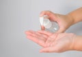 A woman`s hand is pressing an alcohol gel to wash her hands to kill bacteria and coronavirus or covid-19 Royalty Free Stock Photo