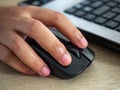 Woman`s hand is pressing the Mouse,Work form home during the epidemic