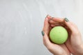 Woman`s hand putting bath bomb into water Royalty Free Stock Photo