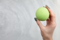 Woman`s hand putting bath bomb into water Royalty Free Stock Photo