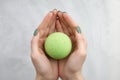 Woman`s hand putting bath bomb into water Royalty Free Stock Photo