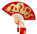 Woman`s hand with a red chinese fan with gold decorative gragon