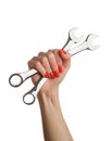 Woman& x27;s hand with a red manicure and a wrench. Royalty Free Stock Photo