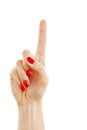 Woman's hand with red nails pointing with index finger Royalty Free Stock Photo