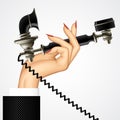 Woman`s hand with retro black phone Royalty Free Stock Photo