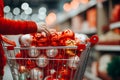 A woman's hand takes a ball from a shopping basket filled with New Year's toy balls. New Year decor shopping Royalty Free Stock Photo