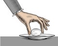 A woman`s hand takes an egg from a plate