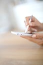 Woman's hand with touch pen writing on smartphone Royalty Free Stock Photo