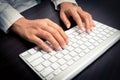 Woman's hand typing on computer keyboard Royalty Free Stock Photo