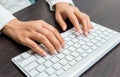 Woman's hand typing on computer keyboard Royalty Free Stock Photo