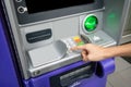 Woman`s hand using an ATM. Business woman using an atm machine