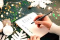 Woman& x27;s Hand writing New Year 2022 goals list Royalty Free Stock Photo