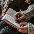 Womanâs hand writing in notebook with pen, emphasizing creativity, personal thoughts, and self-reflection Royalty Free Stock Photo