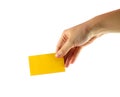 Woman's hand and yellow card