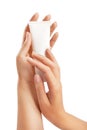 Woman's hands with care cream tube