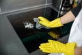 Woman's hands cleaning induction cooker Royalty Free Stock Photo