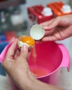 Woman`s hands cracking eggs Royalty Free Stock Photo