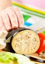 Woman's hands cutting aubergine eggplant