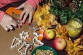 Woman's hands cutting gingerbread christmas cookies