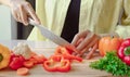 Woman's hands cutting vegetables in the kitchen close-up Royalty Free Stock Photo