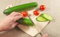 Woman's hands cutting vegetables on wooden Board Royalty Free Stock Photo