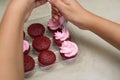 Woman's hands decorating cupcakes Royalty Free Stock Photo