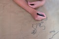 Woman`s hands drawing a map of the world on brow paper