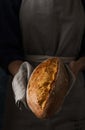 Woman`s hands with fresh homemade bread. Royalty Free Stock Photo