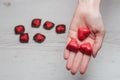 Woman's hands full of chocolate sweets Royalty Free Stock Photo