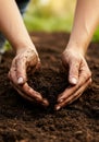 Woman\'s Hands Gently Holding Dark Brown Soil Royalty Free Stock Photo