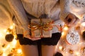 Woman`s hands hold christmas or new year decorated gift box. New Year`s concept.selective focus Royalty Free Stock Photo