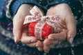 Woman`s hands hold christmas or new year decorated gift box Royalty Free Stock Photo