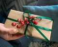 Woman`s hands hold elegant decorated gift box. Merry Christmas concept. Royalty Free Stock Photo