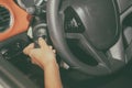 Woman's hands hold the key for starting the car,selective focus Royalty Free Stock Photo