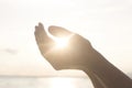 Woman`s hands hold the sun and its energy Royalty Free Stock Photo