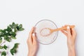 Woman's hands holding bowl of natural sea salt Royalty Free Stock Photo