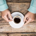 Woman's hands holding cup of coffee Royalty Free Stock Photo