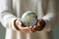 Woman's Hands Holding Earth Globe Model. Generative ai Royalty Free Stock Photo