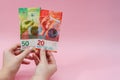 Woman`s hands holding euro banknotes on pink background. Money. Business Royalty Free Stock Photo