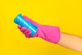 Woman's hands holding a garbage bag on a colored background. Royalty Free Stock Photo