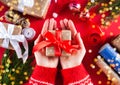 Woman`s hands holding a gift box. Close-up. Top view. Christmas, New Year, Valentine`s day and birthday concept. Royalty Free Stock Photo