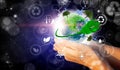 A woman`s hands holding the green planet Earth. Environmental biodiversity in ecosystem concept. Concept of renewable energies. Royalty Free Stock Photo