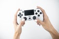 Woman`s hands holding joystick , video gaming, leisure and timespending on while background