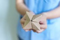 Woman`s hands holding a paper fortune teller Royalty Free Stock Photo